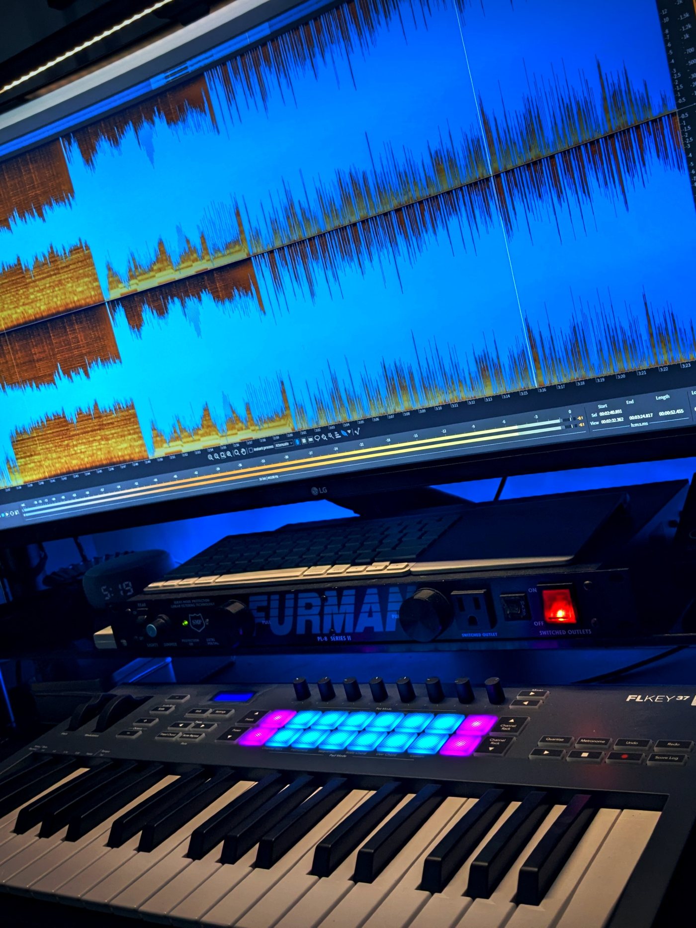 Studio desk detail, iZotope RX waveform editing